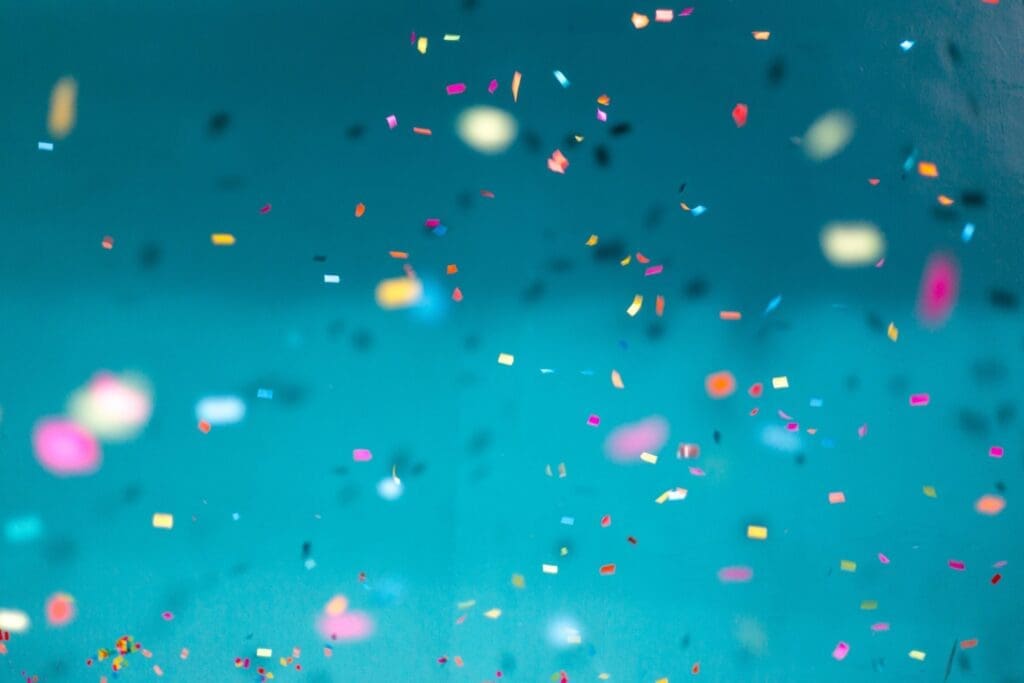 Confetti falling with a blue background