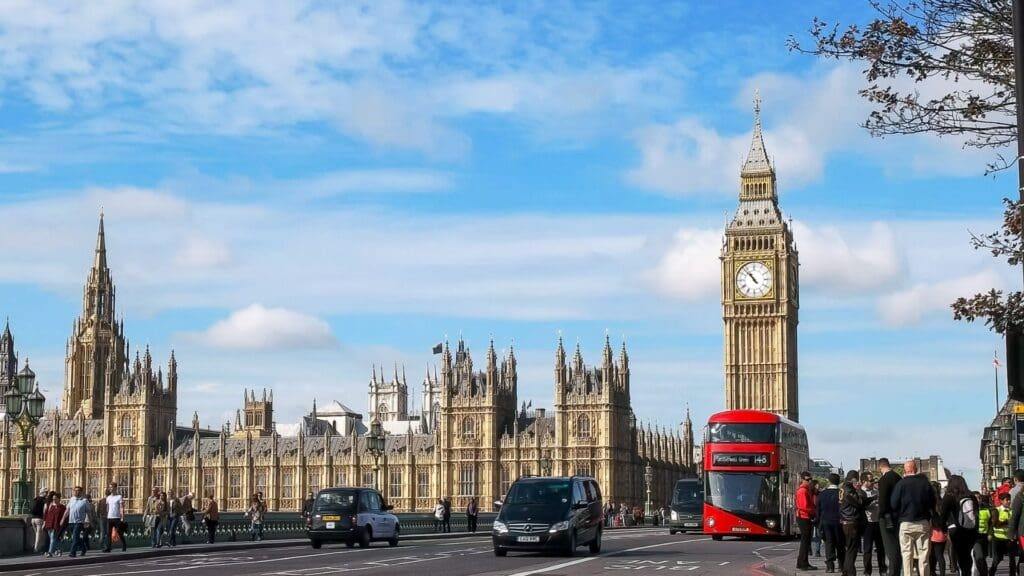 London landscape with Big Ben, buses and cars, Houses of Parliament and lots of pedestrians